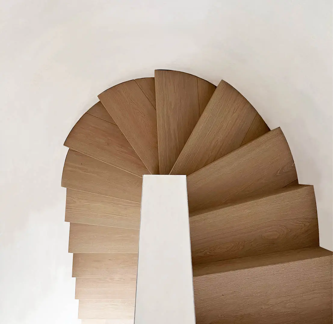 Round wooden spiral staircase seen from above